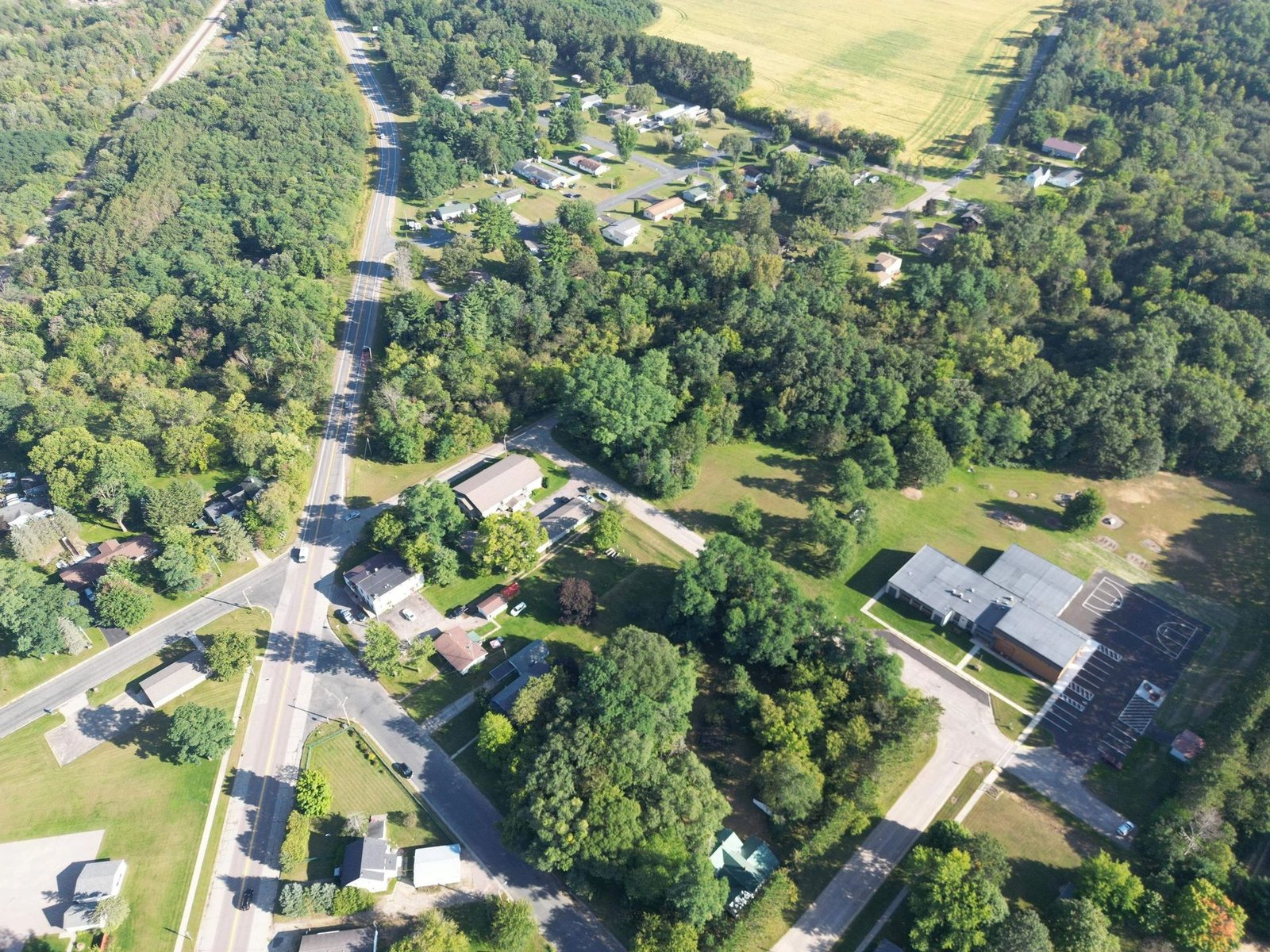 Aerial drone view of Lyndon Station, Wisconsin and the surrounding Juneau County woodland